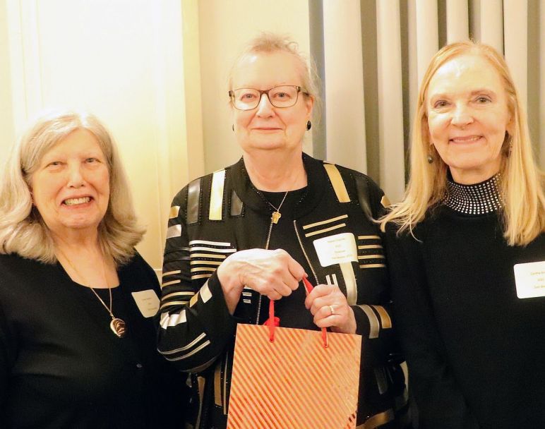 Sue Vizoskie and Elaine Coppola hand over Watson Fund raffle sales to Cindy Brown