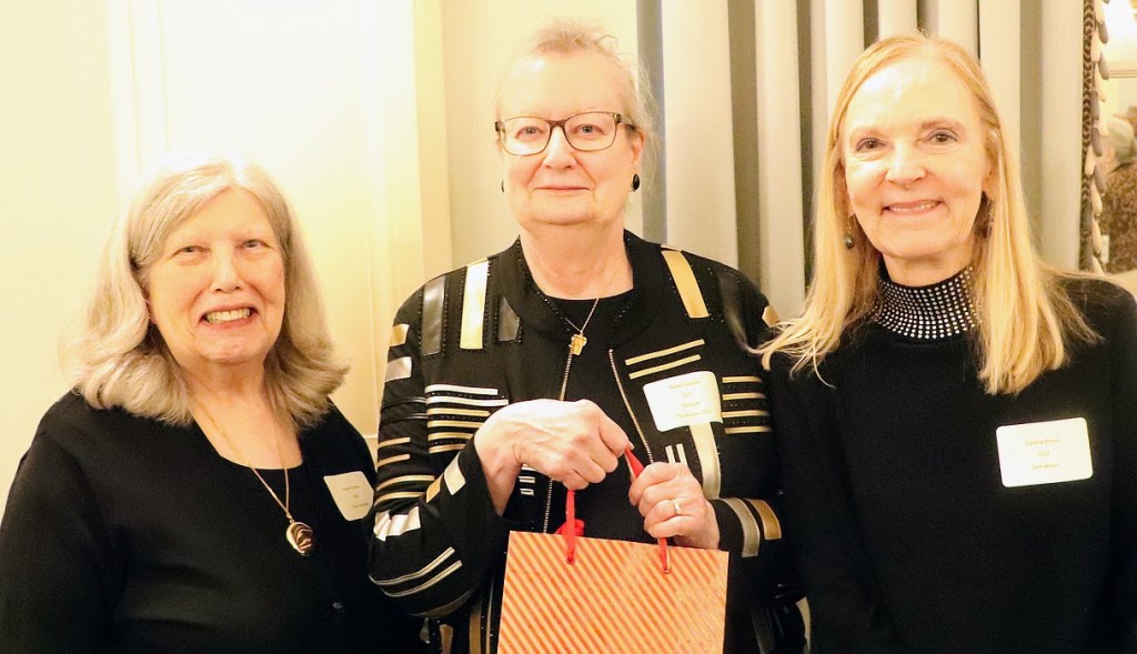Sue Vizoskie and Elaine Coppola hand over Watson Fund raffle sales to Cindy Brown